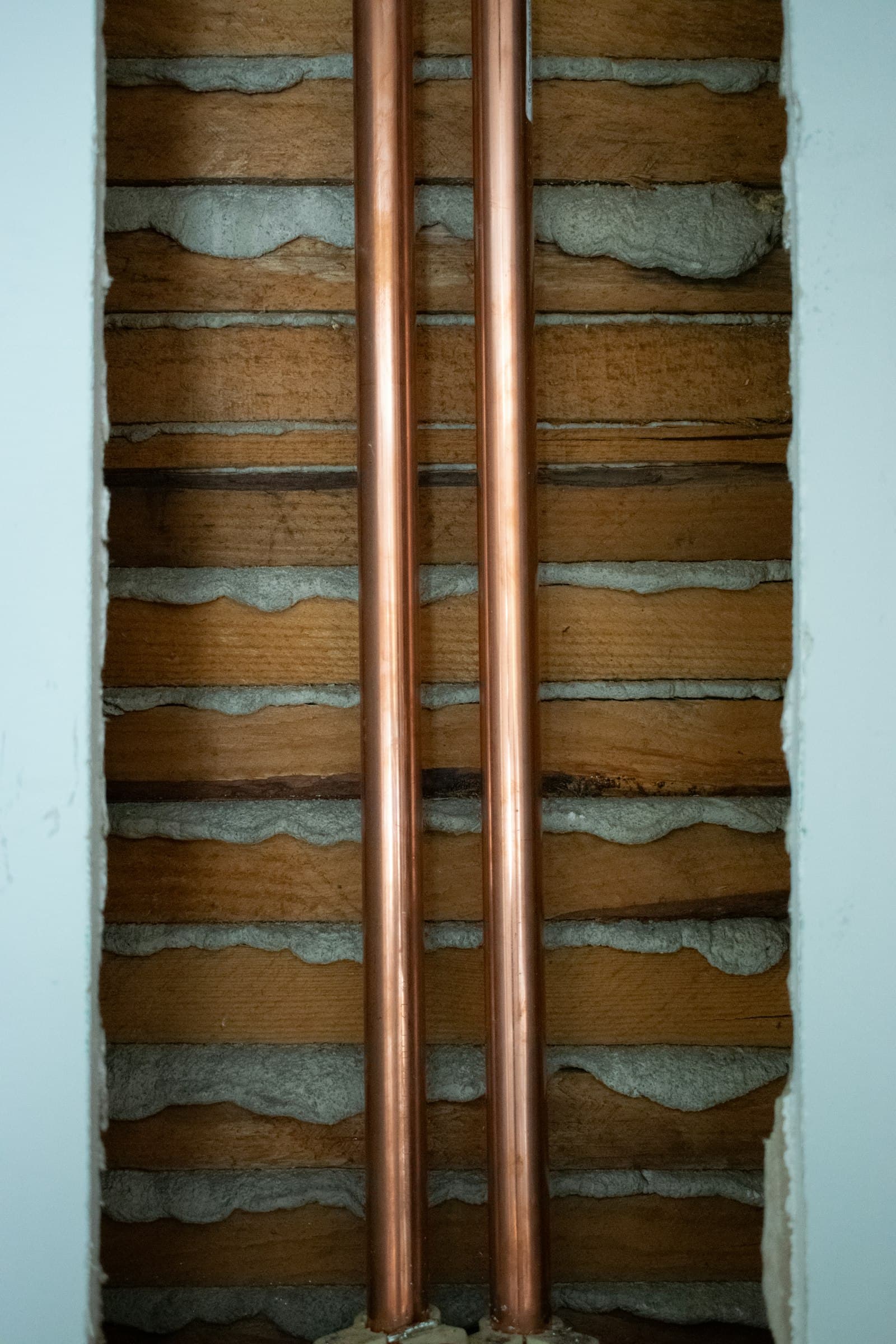 Copper pipes installed in wall framing